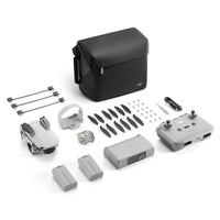 The DJI Mini 4K Drone With RC-N1 Controller in grey on a white background, drone is in it's folded position. Image shows other items that are included with the drone: Gimbal Protector, Spare Propellers, Screwdriver, Screws, DJI RC-N1 RC Cable (USB-C Connector), DJI RC-N1 RC Cable (Lightning Connector), and DJI RC-N1 RC Cable (Standard Micro-USB Connector).